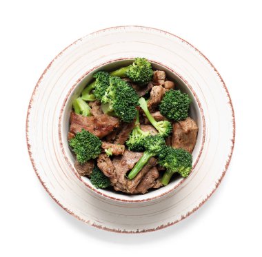 Plate with tasty beef and broccoli on white background clipart