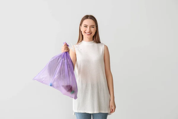 Young Woman Garbage Bag Light Background — Foto de Stock