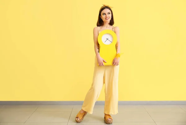 Stylish Young Woman Clock Yellow Wall — Stock Photo, Image