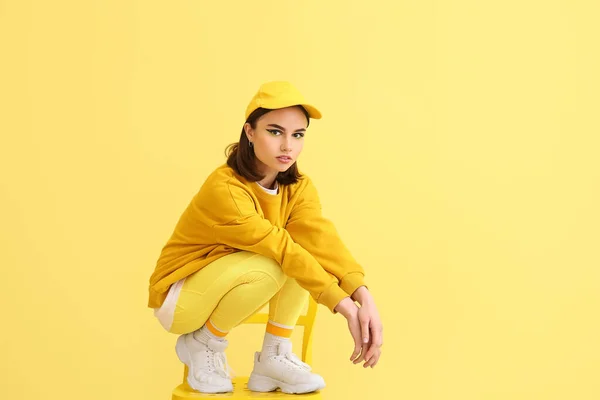 Stylish Young Woman Sitting Chair Yellow Background — Foto de Stock