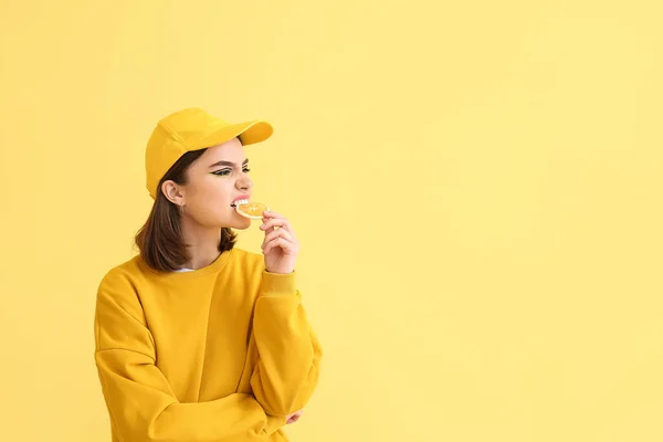 Stylish Young Woman Orange Slice Yellow Background — Foto de Stock