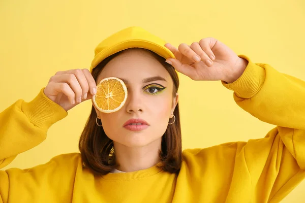 Stylish Young Woman Orange Slice Yellow Background — Foto de Stock