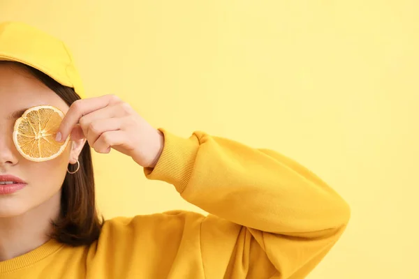 Stylish Young Woman Orange Slice Yellow Background — Foto de Stock