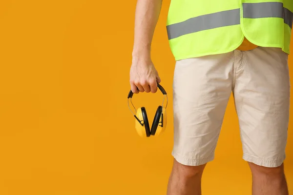 Male Worker Headphones Yellow Background — Foto de Stock