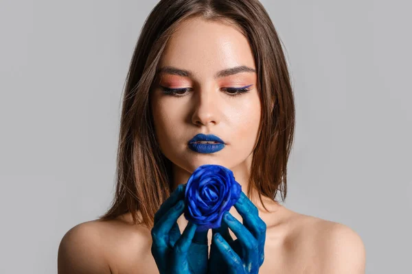 Stylish Young Woman Painted Hands Blue Rose Grey Background —  Fotos de Stock