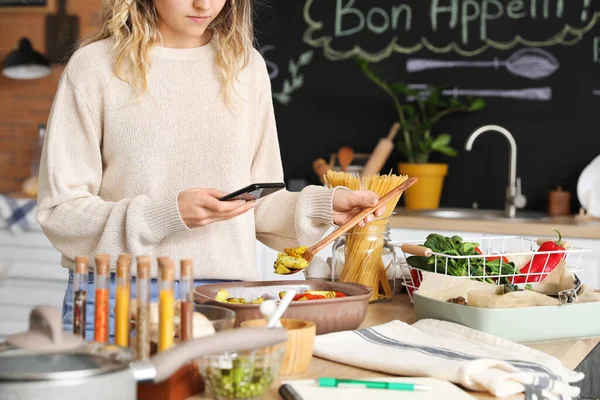 Young Woman Taking Photo Baking Dish Vegetables Kitchen —  Fotos de Stock