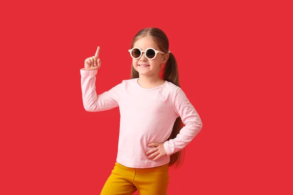 Cute Little Girl Wearing Stylish Sunglasses Pointing Something Color Background — Stock Photo, Image