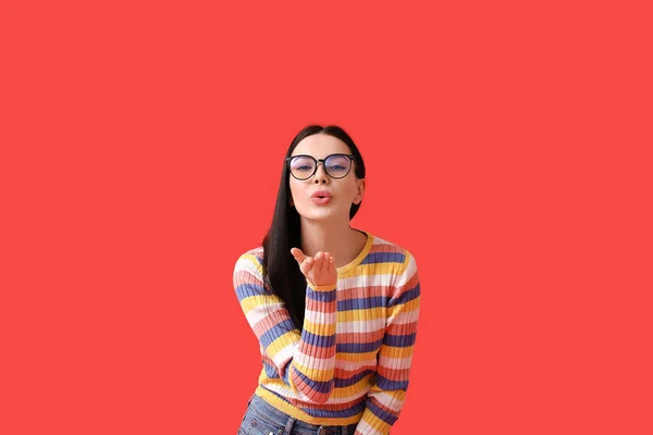 Beautiful Young Woman Wearing Eyeglasses Blowing Kiss Color Background — Stock Photo, Image