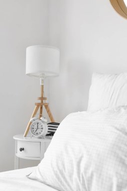 Alarm clock in interior of modern room