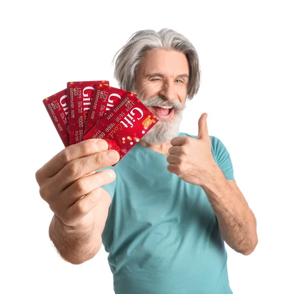 Senior Man Gift Cards Showing Thumb White Background —  Fotos de Stock