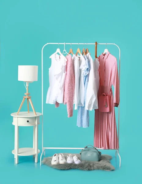 Rack Stylish Clothes Accessories Table Color Background — Foto de Stock