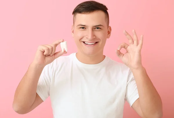 Young Man Plastic Tooth Showing Background —  Fotos de Stock