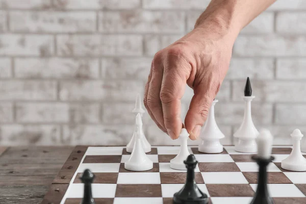 Man Playing Chess Wooden Background — Stock Photo, Image