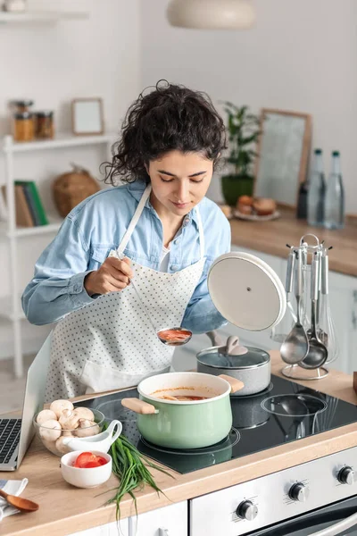 Young Woman Tasting Dish Kitchen — Stock Photo, Image