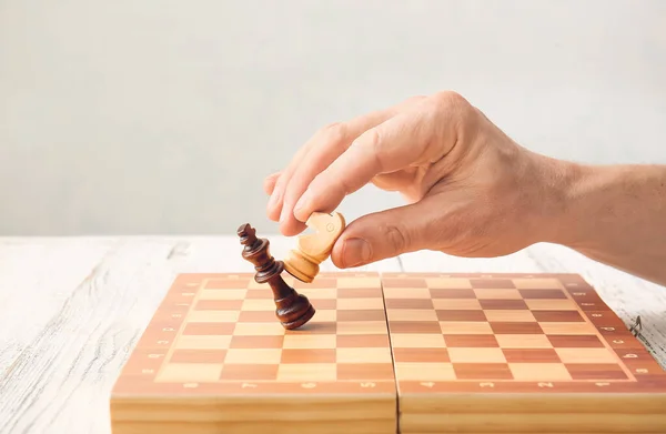 Man Playing Chess White Wooden Background — Stock Photo, Image