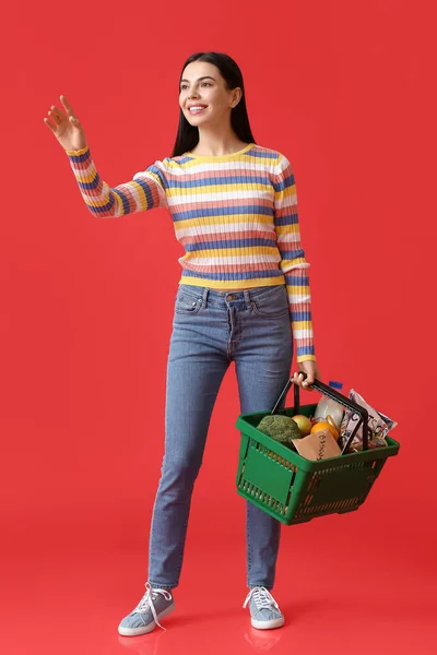 Young Woman Shopping Basket Color Background — Stock Photo, Image