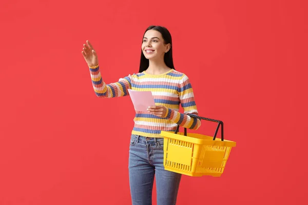 Young Woman Shopping Basket List Products Color Background — Stock Photo, Image