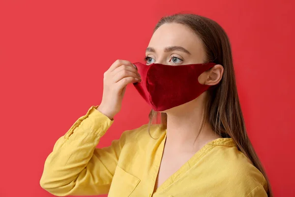 Stylish Young Woman Putting Mask Color Background — Stock Photo, Image