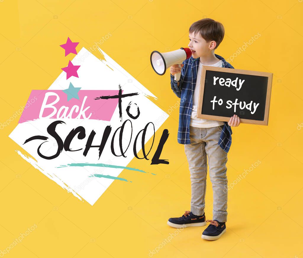 Little schoolboy with megaphone holding chalkboard with text READY TO STUDY on color background. Back to school