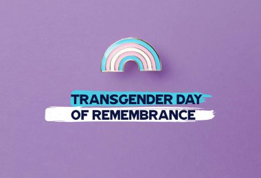 Rainbow badge and text TRANSGENDER DAY OF REMEMBRANCE on color background