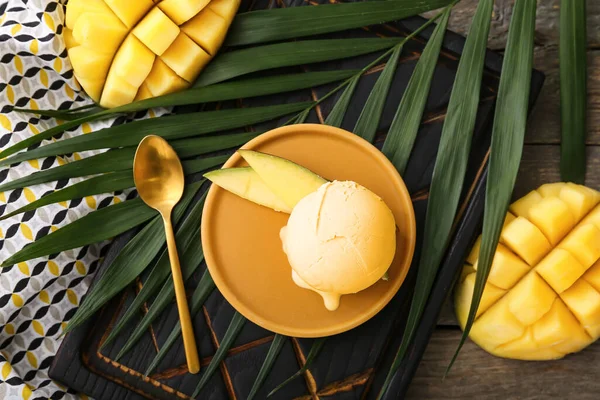 Plate Tasty Mango Ice Cream Palm Leaf Wooden Background — Stock Photo, Image