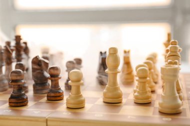 Chess pieces on game board, closeup