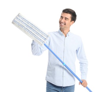 Young man with floor mop on white background