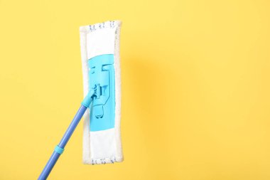 Floor mop on color background, closeup