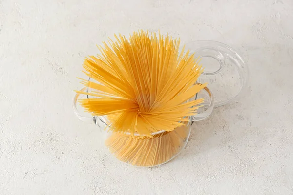 Stylish Cooking Pot Uncooked Pasta White Background — Stockfoto