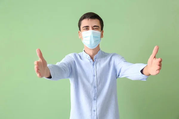 Young Man Medical Mask Opening Arms Hug Color Background — Stockfoto