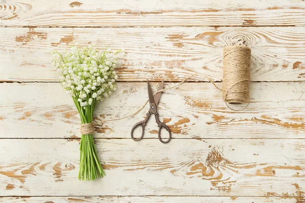 Beautiful Lily Valley Flowers Scissors Rope Light Wooden Background — Stock Photo, Image
