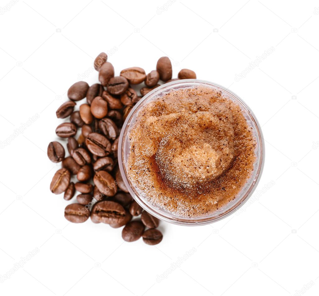 Jar with body scrub and coffee beans on white background