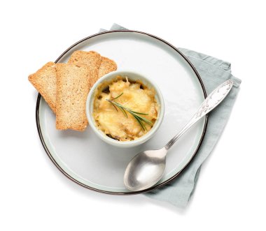 Ramekin with tasty julienne and crispbreads on white background