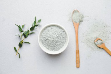 Composition with cosmetic clay on grey background