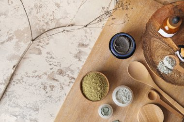 Composition with different cosmetic clay on grunge background