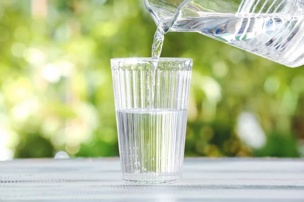 Pouring Fresh Water Jar Glass Table Outdoors Closeup — Stock Photo, Image