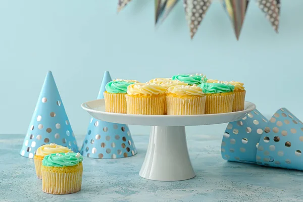 Dessert Stand Tasty Cupcakes Party Hats Color Background — Stock Photo, Image