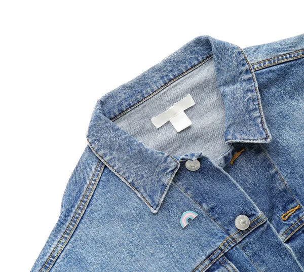 Pinned badge as symbol of transgender on clothes against white background