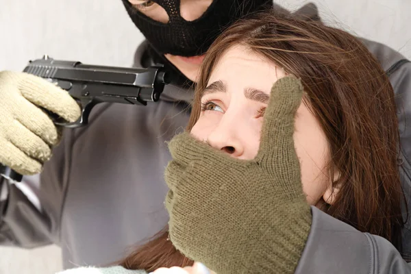 Terrorist Aiming Female Hostage Outdoors —  Fotos de Stock