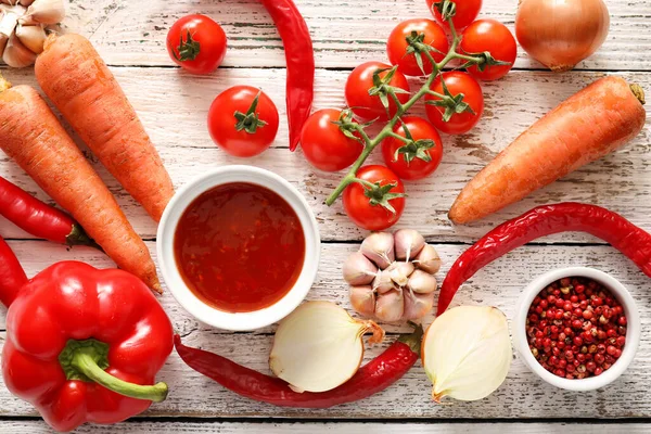 Composition Tasty Chili Sauce Ingredients Light Wooden Background — Stock Photo, Image