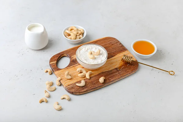 Composition Cashew Sour Cream Nuts Honey Light Background — Stock Photo, Image