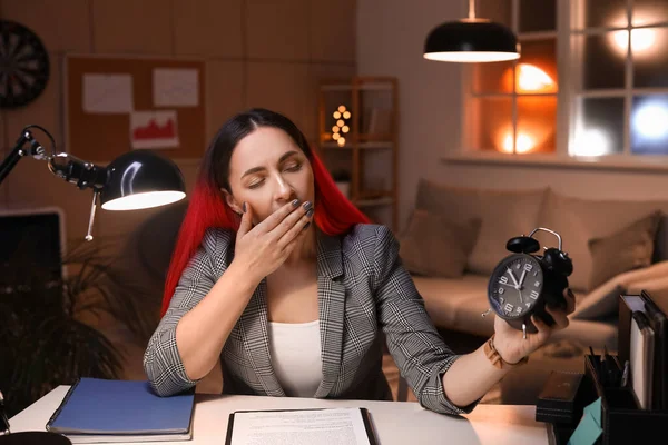 Tired Young Woman Alarm Clock Office Night — Stock Photo, Image