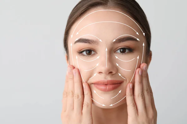 Beautiful Woman Massaging Her Face Light Background — Stock Photo, Image