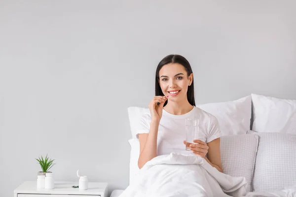 Beautiful Young Woman Taking Pills Bedroom — Stock Photo, Image