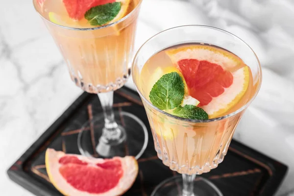 Glasses Tasty Grapefruit Cocktail Light Background Closeup — Stock Photo, Image