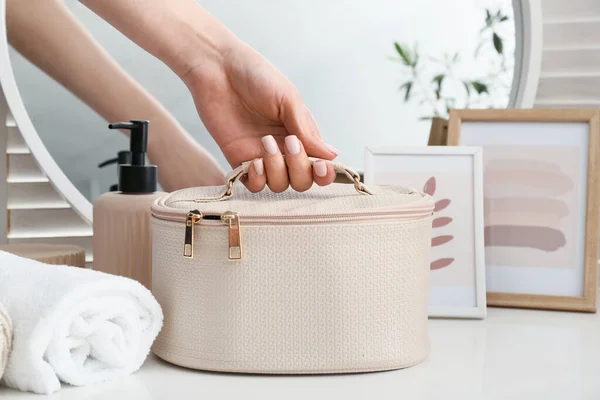 Female Hand Stylish Cosmetic Bag Table Room — Stock Photo, Image