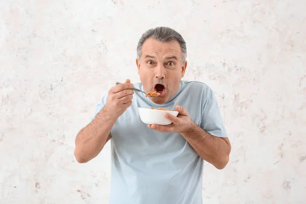 Senior Man Eating Cornflakes White Background — Stock Photo, Image