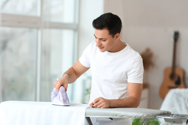 Handsome Young Man Ironing Clothes Home — Stock Photo, Image
