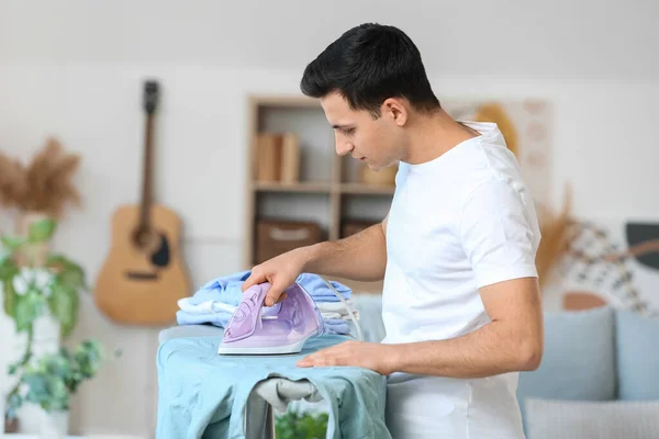 Handsome Young Man Ironing Clothes Home — Stock Photo, Image