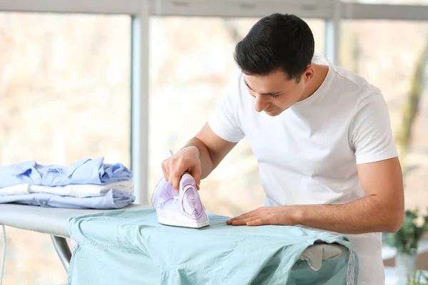 Handsome Young Man Ironing Clothes Home — Stock Photo, Image